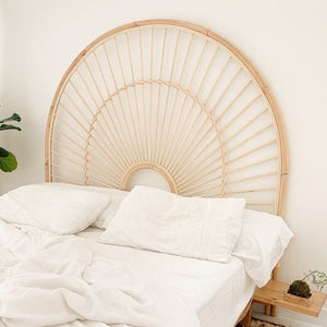A classic cane wooden headboard adds charm to your bedroom décor.