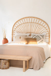 "This cane wooden headboard adds character and warmth to your sleeping area."