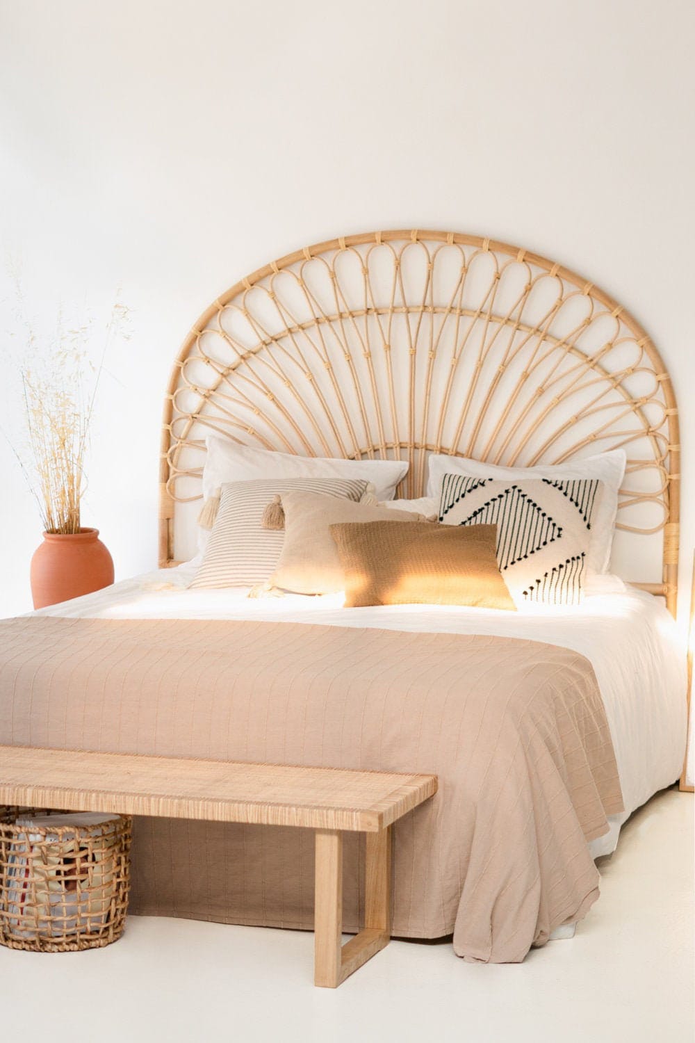 "This cane wooden headboard adds character and warmth to your sleeping area."